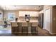 Modern kitchen with island, white cabinets, and granite countertops at 4364 Reding Way, Lakeland, FL 33813