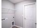 Laundry room with washer/dryer hookups and extra shelving at 4364 Reding Way, Lakeland, FL 33813