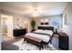 Main bedroom with king-size bed and en-suite bathroom at 4364 Reding Way, Lakeland, FL 33813