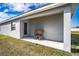 Covered patio with a wooden bench at 4364 Reding Way, Lakeland, FL 33813