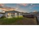 Spacious backyard featuring a screened porch and above-ground pool, perfect for outdoor living at 566 Valentina Ln, Auburndale, FL 33823