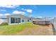 Backyard with a screened lanai and a above ground pool, perfect for outdoor relaxation and enjoyment at 566 Valentina Ln, Auburndale, FL 33823