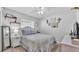 Cozy bedroom with a white bed frame, decorative accents, and ample natural light at 566 Valentina Ln, Auburndale, FL 33823