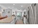 Modern kitchen with granite countertops, stainless steel appliances, and an open layout to the dining area at 566 Valentina Ln, Auburndale, FL 33823