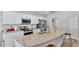 Modern kitchen featuring stainless steel appliances, granite countertops, and ample cabinet space at 566 Valentina Ln, Auburndale, FL 33823