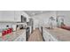 Modern kitchen featuring granite countertops, stainless steel appliances, and ample cabinet space at 566 Valentina Ln, Auburndale, FL 33823