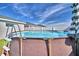 This above-ground pool, surrounded by a privacy fence, is ready for you to enjoy on a hot summer day at 566 Valentina Ln, Auburndale, FL 33823