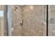 This shower features beautiful stone-look tile with a built-in shelf for bath essentials at 566 Valentina Ln, Auburndale, FL 33823