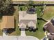 Stunning aerial view showcases a private pool, fenced yard and meticulously landscaped grounds at 5808 Driftwood Dr, Winter Haven, FL 33884