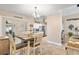 Bright dining area with a table for four and glass doors leading to the lanai at 5808 Driftwood Dr, Winter Haven, FL 33884