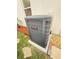 Efficient HVAC unit with modern design, installed on a concrete slab, surrounded by mulch and decorative rocks at 5808 Driftwood Dr, Winter Haven, FL 33884
