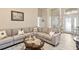 Comfortable living room features a large sectional sofa, decorative pillows, and a glass-topped coffee table at 5808 Driftwood Dr, Winter Haven, FL 33884