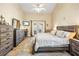 Inviting main bedroom with a vaulted ceiling, and a king bed with soft, neutral bedding at 5808 Driftwood Dr, Winter Haven, FL 33884