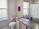 Bathroom with vanity, toilet and shower/tub combo at 1333 Rebecca Dr, Haines City, FL 33844