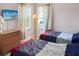 Bedroom with two twin beds and a dresser at 1333 Rebecca Dr, Haines City, FL 33844