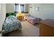 Cozy bedroom with twin beds and ample natural light at 1333 Rebecca Dr, Haines City, FL 33844