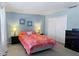 Primary bedroom with king-size bed and neutral decor at 1333 Rebecca Dr, Haines City, FL 33844