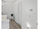 Bright hallway with light flooring and access to bedrooms at 1333 Rebecca Dr, Haines City, FL 33844