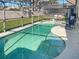 Inviting kidney-shaped pool with screened enclosure at 1333 Rebecca Dr, Haines City, FL 33844