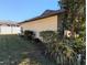 Lush backyard with manicured lawn, green bushes, and partial view of fence at 16 Kendra Ct # 16, Winter Haven, FL 33880