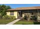 Cozy single-story home boasting a screened porch, manicured landscaping, and a neatly kept lawn at 16 Kendra Ct # 16, Winter Haven, FL 33880