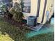 Exterior view of well-maintained air conditioning unit set amidst lush landscaping at 16 Kendra Ct # 16, Winter Haven, FL 33880