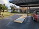 Charming single-story home with covered parking, manicured lawn, and well-kept landscaping at 16 Kendra Ct # 16, Winter Haven, FL 33880