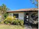 Inviting home exterior with an open porch, tidy landscaping, and a well-kept lawn at 16 Kendra Ct # 16, Winter Haven, FL 33880