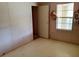 Small bedroom with a window and tile flooring at 4022 Carter Ct, Polk City, FL 33868