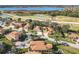 Stunning aerial view of the community showcases a lake, golf course, and beautiful homes at 4101 Limerick Dr, Lake Wales, FL 33859