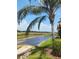 Scenic backyard with lush grass, a charming canal, and a picturesque view of the surrounding landscape at 4101 Limerick Dr, Lake Wales, FL 33859