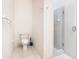 Bathroom featuring a toilet and walk-in shower with a clear glass door at 4101 Limerick Dr, Lake Wales, FL 33859