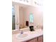 Bright bathroom featuring a double sink vanity, large mirror, and a shower at 4101 Limerick Dr, Lake Wales, FL 33859