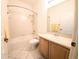 Well-lit bathroom featuring a shower-tub combo and a vanity with ample counter space at 4101 Limerick Dr, Lake Wales, FL 33859