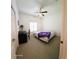 Cozy bedroom with ceiling fan, desk, and comfortable bed, flooded with natural light at 4101 Limerick Dr, Lake Wales, FL 33859