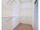 Spacious walk-in closet with wire shelving and carpeted floor at 4101 Limerick Dr, Lake Wales, FL 33859