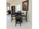 Dining table with four chairs is situated next to the living room at 4101 Limerick Dr, Lake Wales, FL 33859