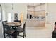 Dining area view showing an open layout with an eat-in kitchen bar at 4101 Limerick Dr, Lake Wales, FL 33859