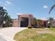 Inviting single Gathering home with lush landscaping, paved driveway and two-car garage at 4101 Limerick Dr, Lake Wales, FL 33859
