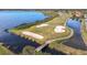 Scenic aerial view of a lush golf course alongside a tranquil lake, offering a picturesque and recreational landscape at 4101 Limerick Dr, Lake Wales, FL 33859