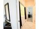 Hallway view with a laundry closet and a glimpse of an office at 4101 Limerick Dr, Lake Wales, FL 33859