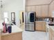Open kitchen with stainless steel appliances and tile flooring at 4101 Limerick Dr, Lake Wales, FL 33859