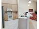 Well-equipped kitchen with stainless steel appliances and a convenient breakfast bar overlooking the Gathering room at 4101 Limerick Dr, Lake Wales, FL 33859