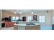 Kitchen with island and sink overlooking the living area, and lots of natural light at 4101 Limerick Dr, Lake Wales, FL 33859