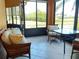 Comfortable lanai with tile floor and cozy furniture, with great views to the outside at 4101 Limerick Dr, Lake Wales, FL 33859