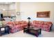 Comfortable living room featuring a neutral color palette, tile floors, and plenty of space for entertaining at 4101 Limerick Dr, Lake Wales, FL 33859
