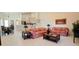 Bright living room with tile flooring, light neutral walls, and access to the dining area and kitchen at 4101 Limerick Dr, Lake Wales, FL 33859
