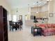 Bright living space with a dining area, kitchen, and access to the outdoors at 4101 Limerick Dr, Lake Wales, FL 33859