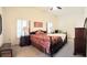 Main bedroom features a ceiling fan, shuttered windows, and carpeted floor at 4101 Limerick Dr, Lake Wales, FL 33859
