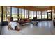 Bright sunroom with neutral tile flooring, furnishings and large windows offering tranquil views of the surrounding landscape at 4101 Limerick Dr, Lake Wales, FL 33859